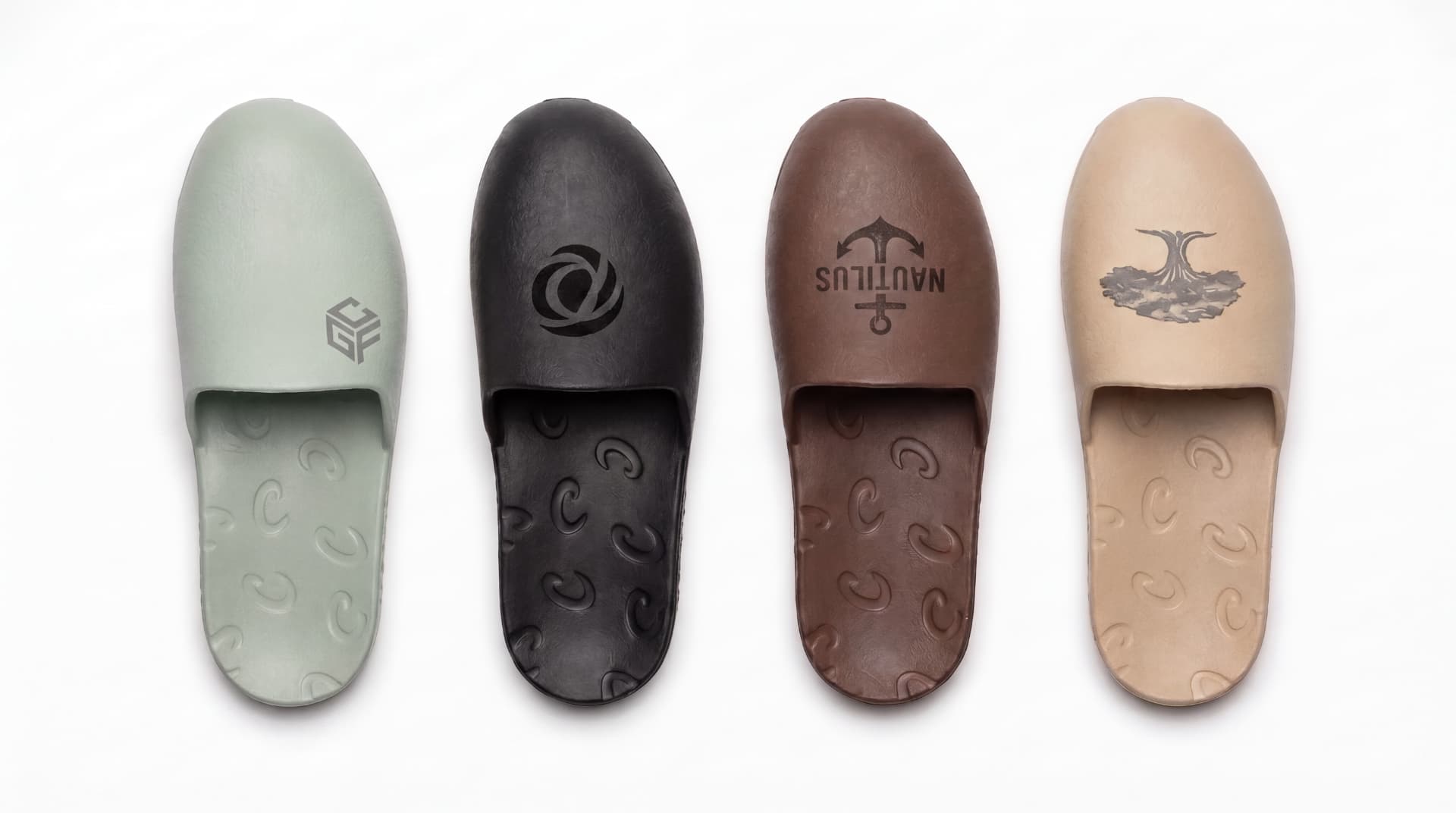 Four Creams closed-toe slides in sage, black, brown, and tan with custom laser engravings