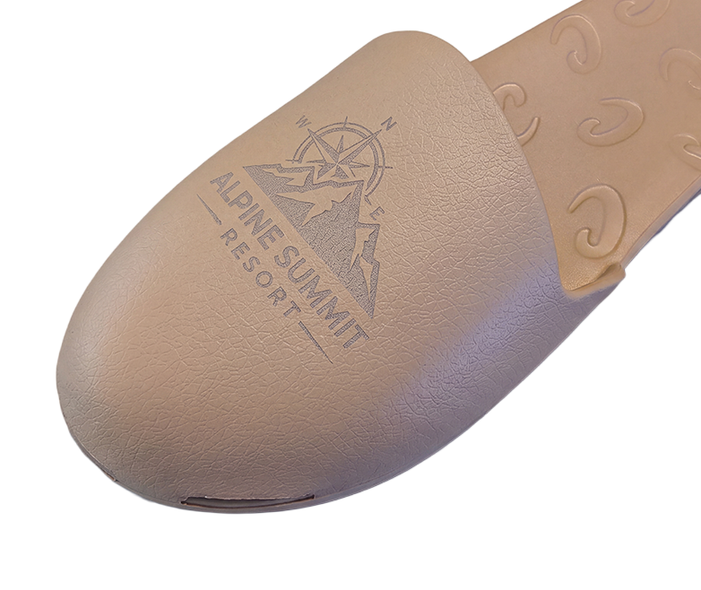 Alpine Summit Resort logo laser engraved on a tan Creams toe cap